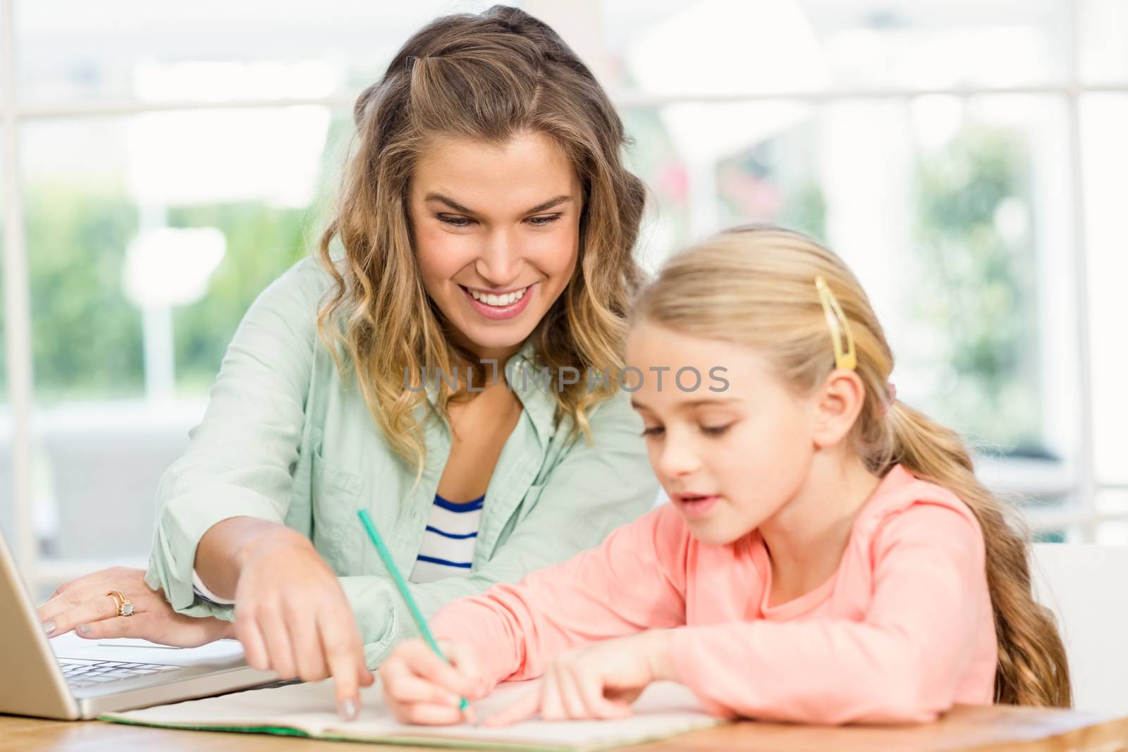Mother checking her daughters homework