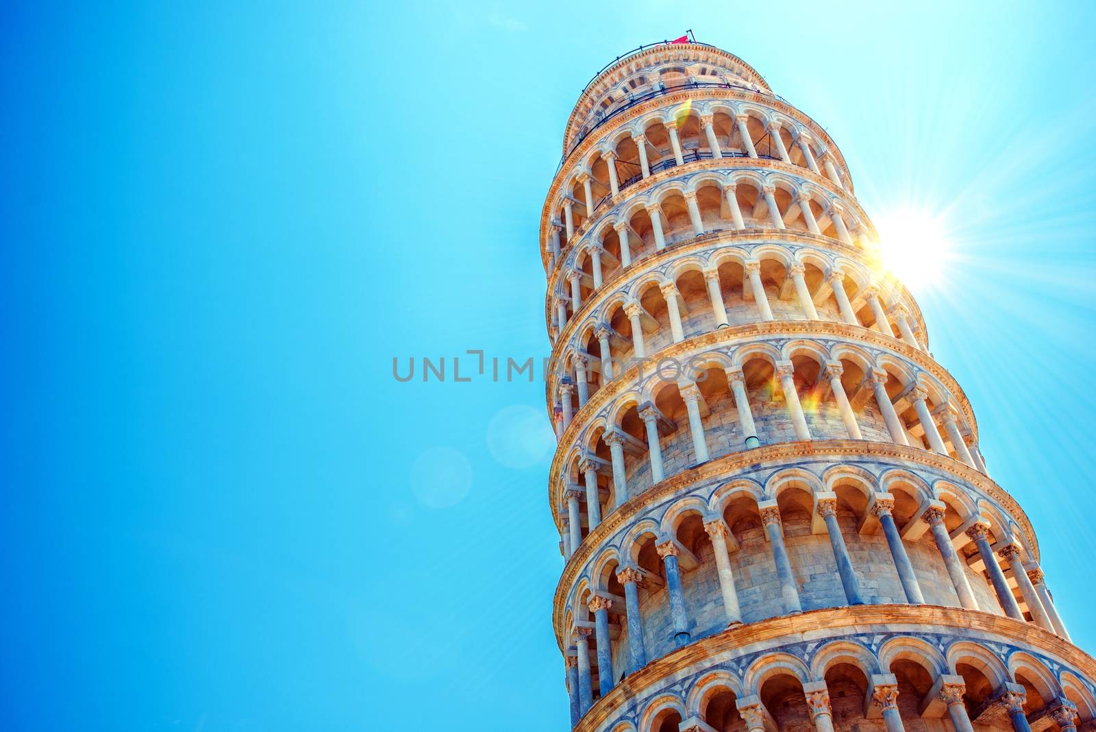 Leaning Tower of Pisa, Italy, Europe. Tower of Pisa Over Blue Sky. Italian Architecture.