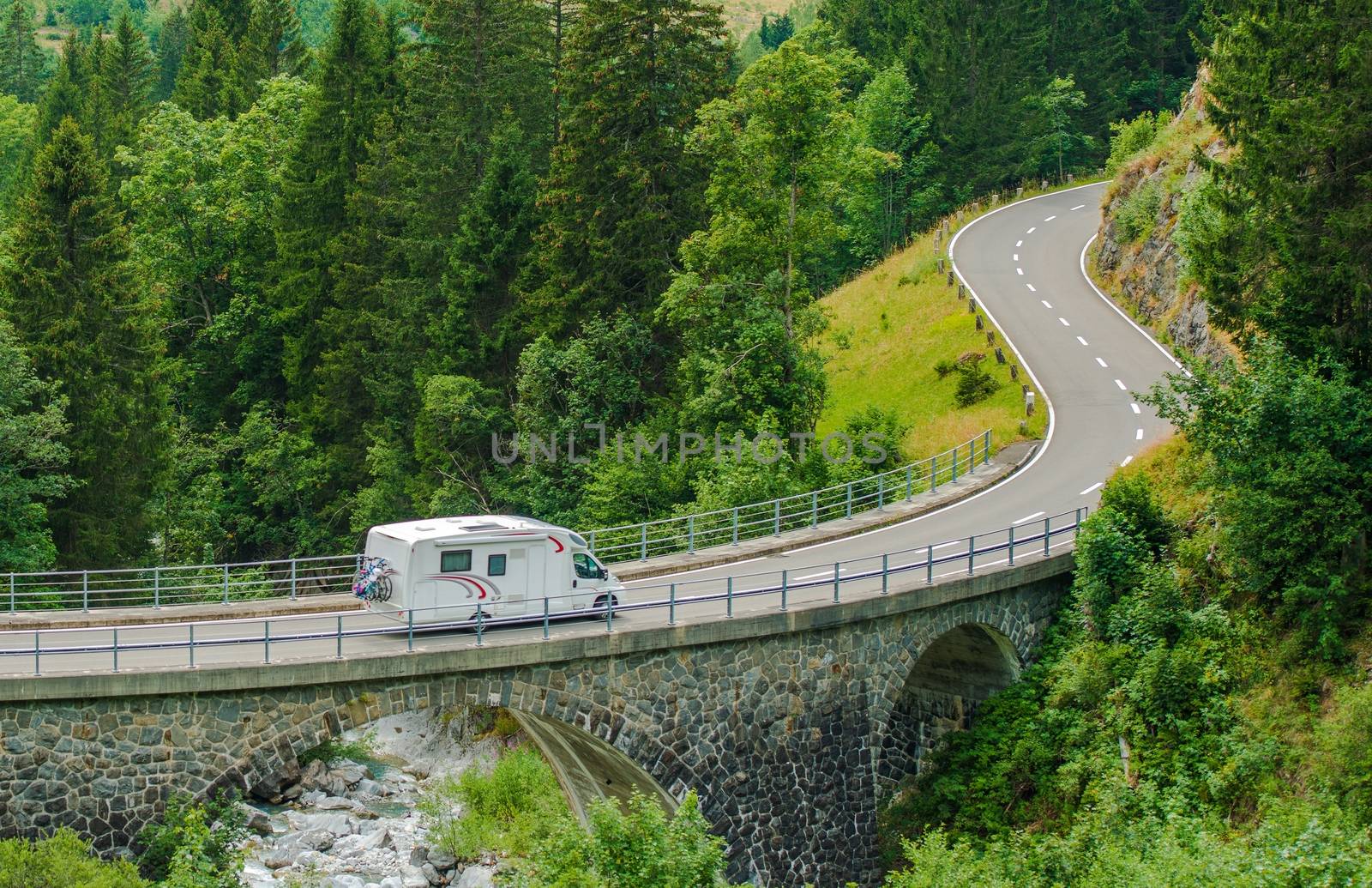RV Camper Van Trip. Camper Van on the Mountain Road Bridge in Swiss Alps. Camper Traveling.
