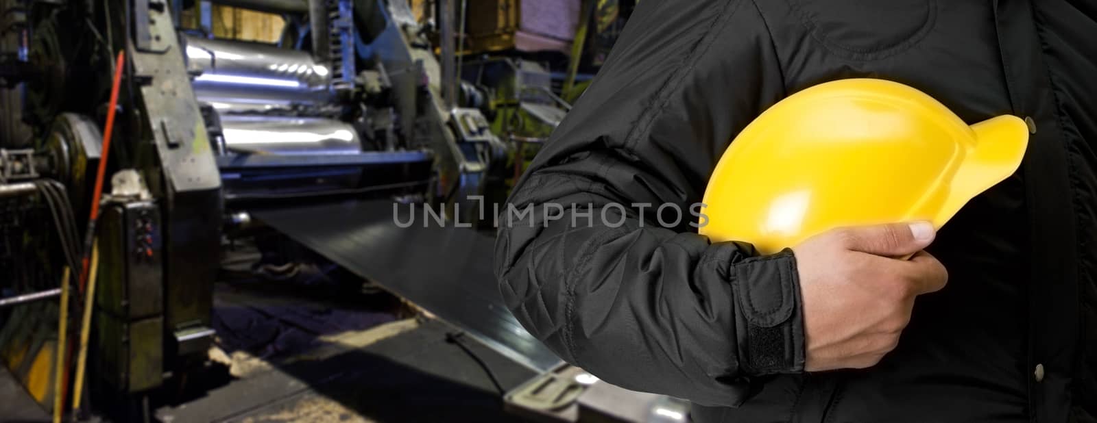 Worker with safety helmet at industrial factory