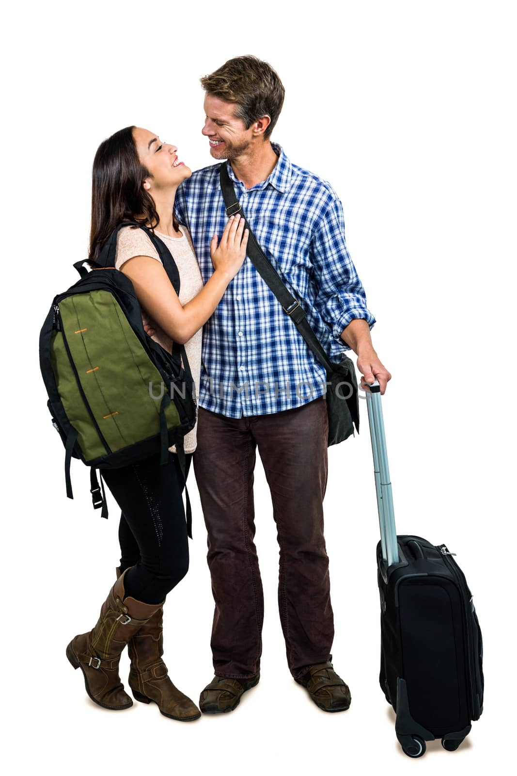 Full length of couple with bags embracing each other against white background