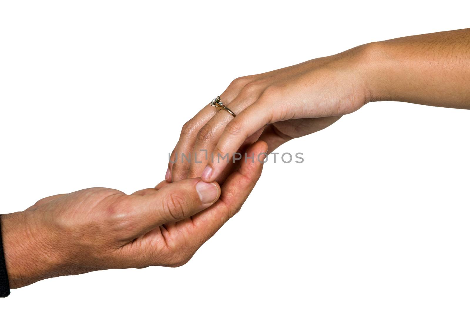 Cropped hand of couple holding hands against white background