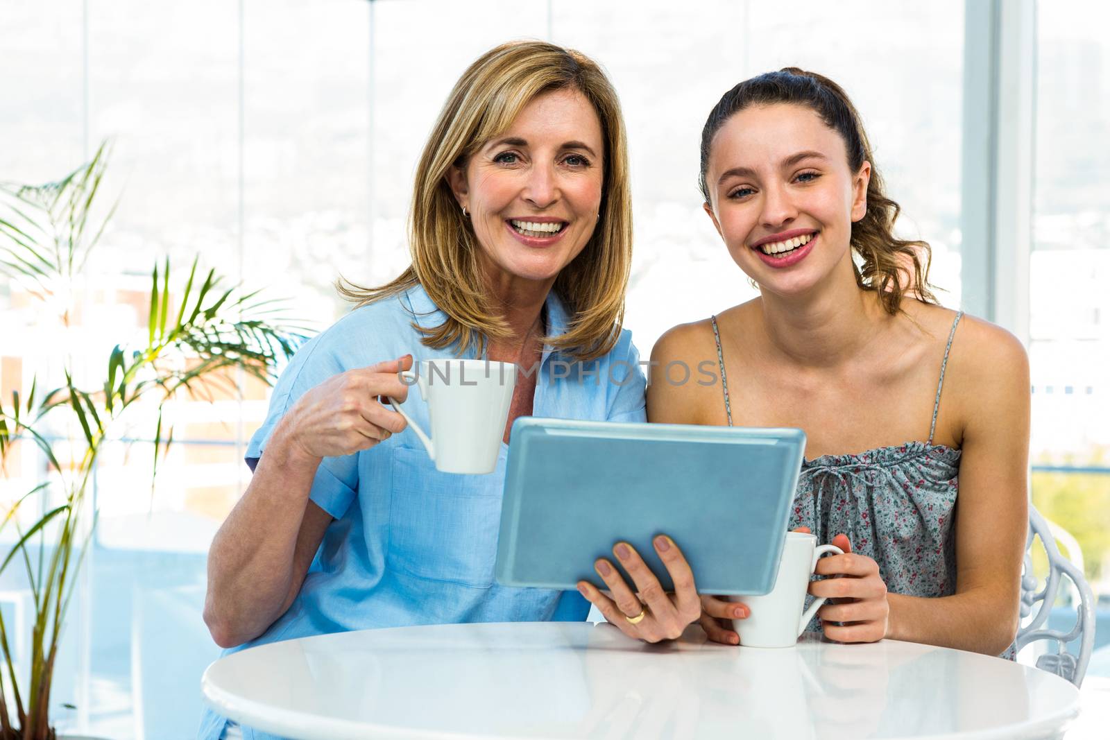 Mother and daughter watch tablet by Wavebreakmedia