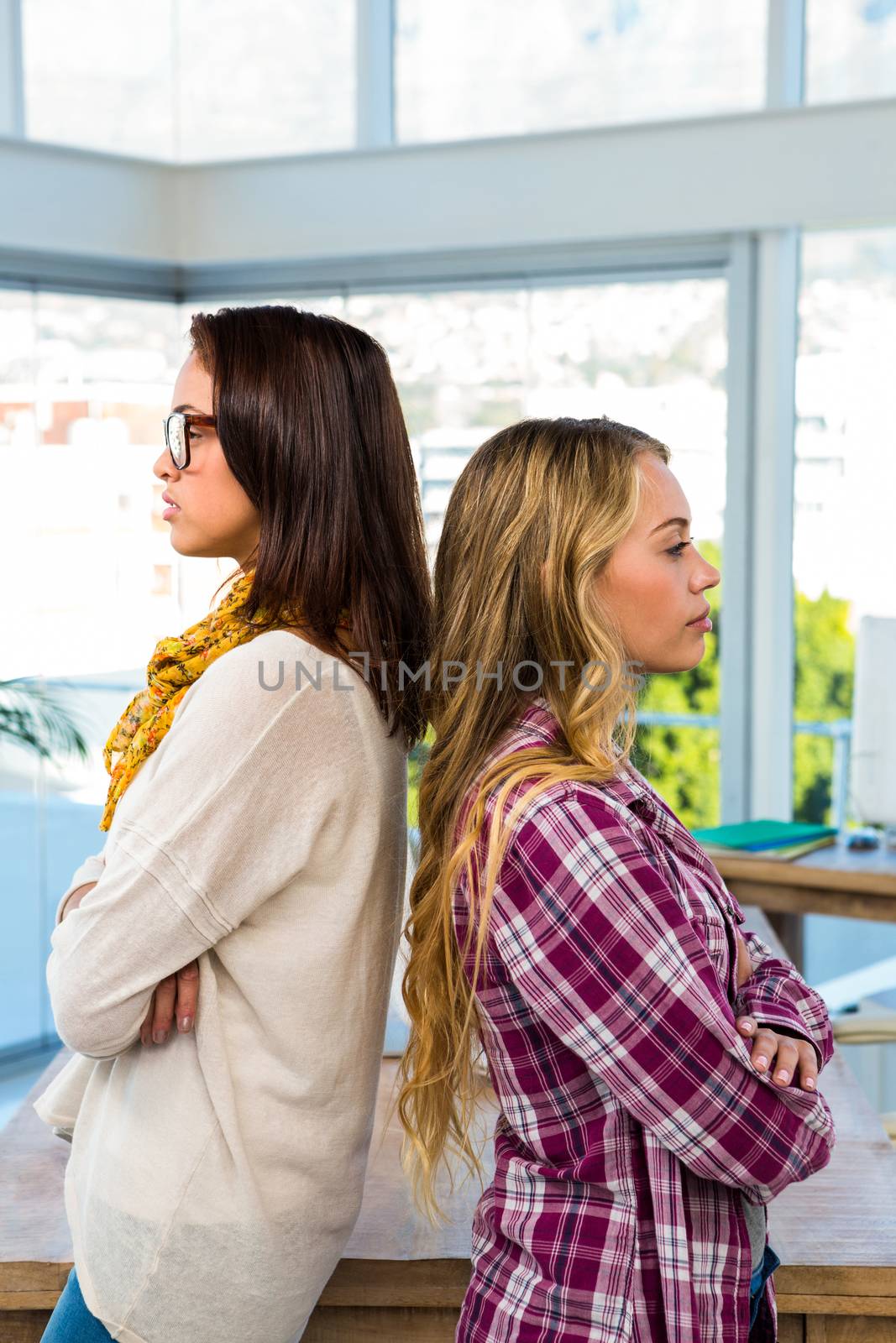 Two girls work at office and are concentrated