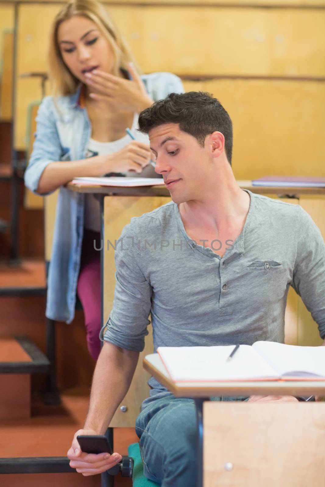Cheating students during exam by Wavebreakmedia