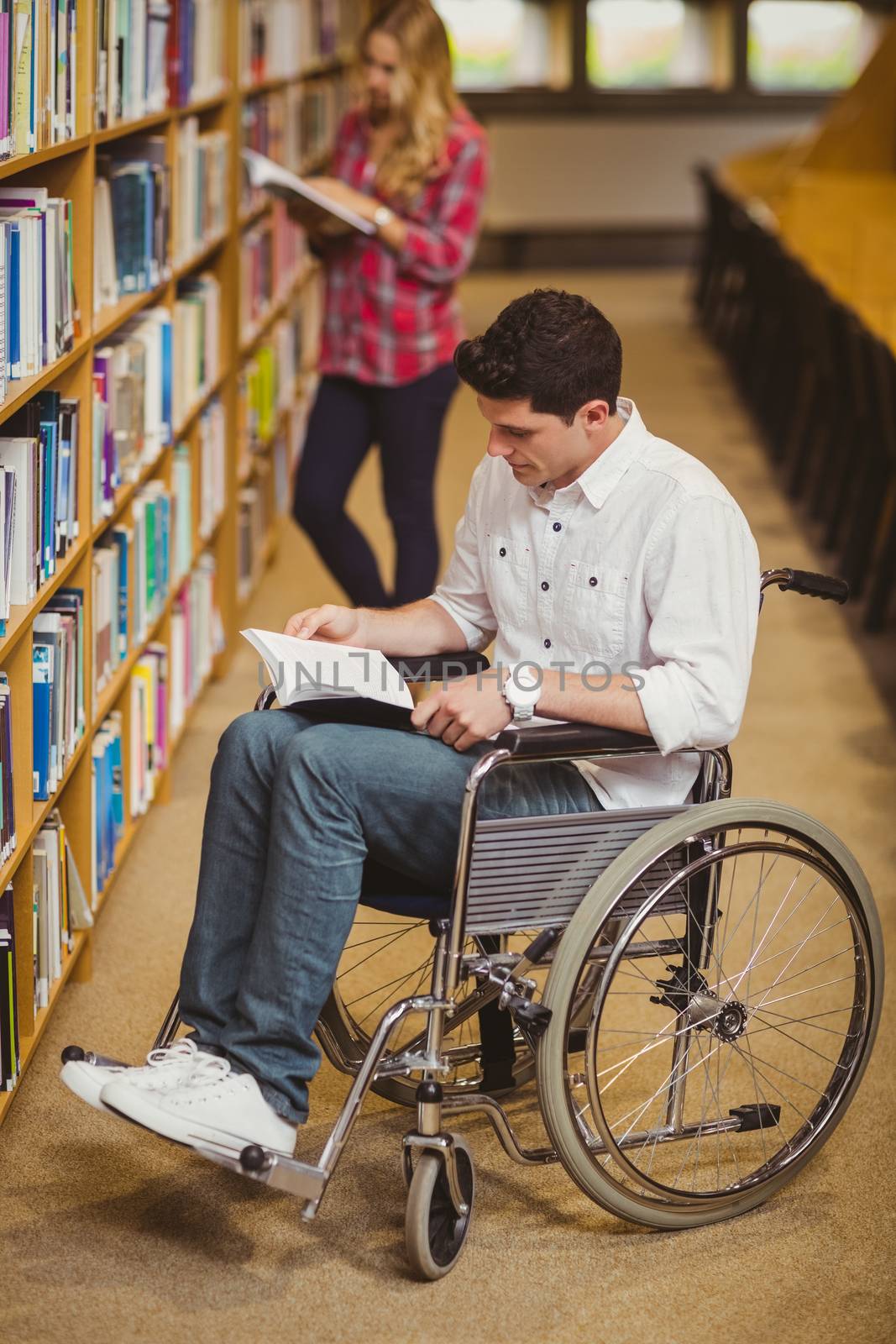 Student in wheelchair talking with classmate by Wavebreakmedia