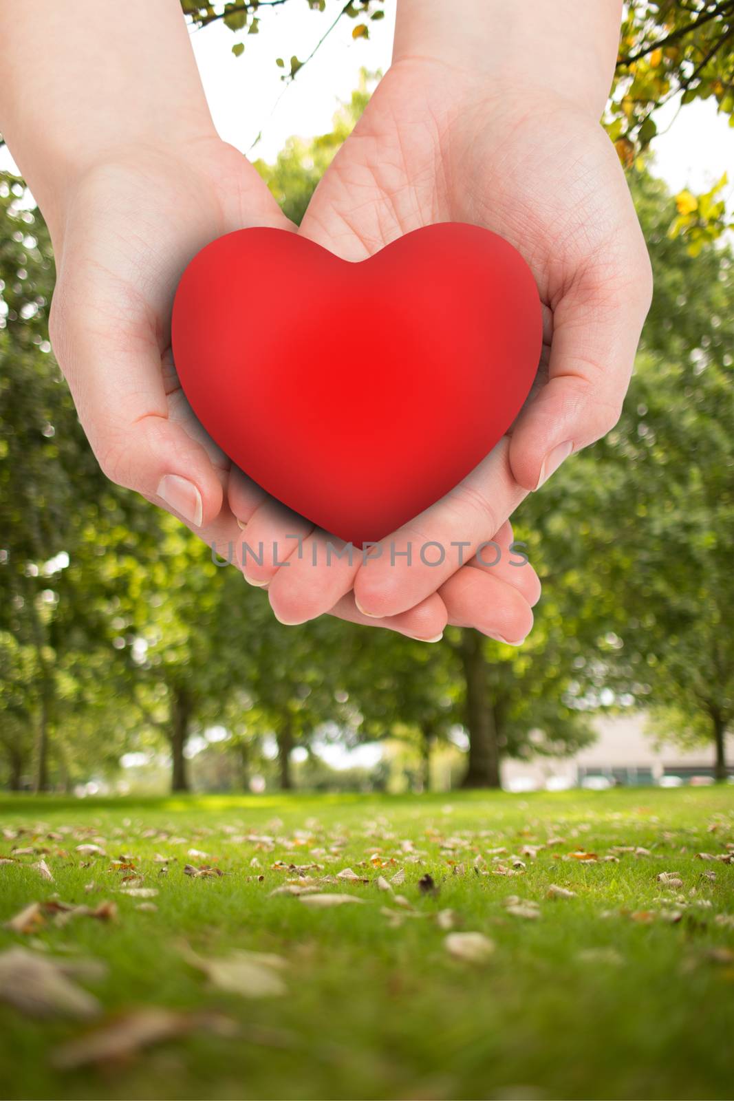 Composite image of hand showing heart by Wavebreakmedia