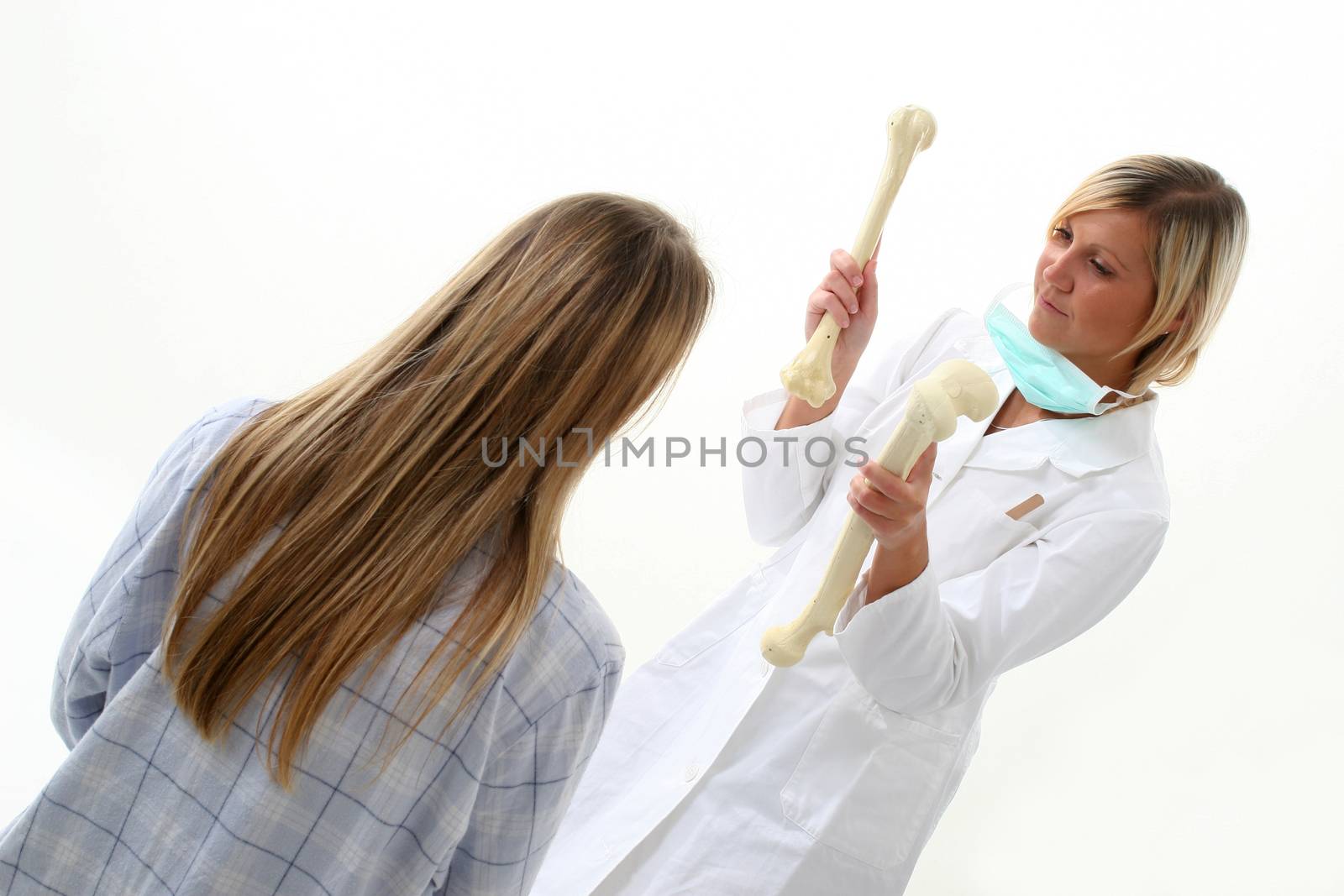 Doctor showing pacient how she has broken her bones