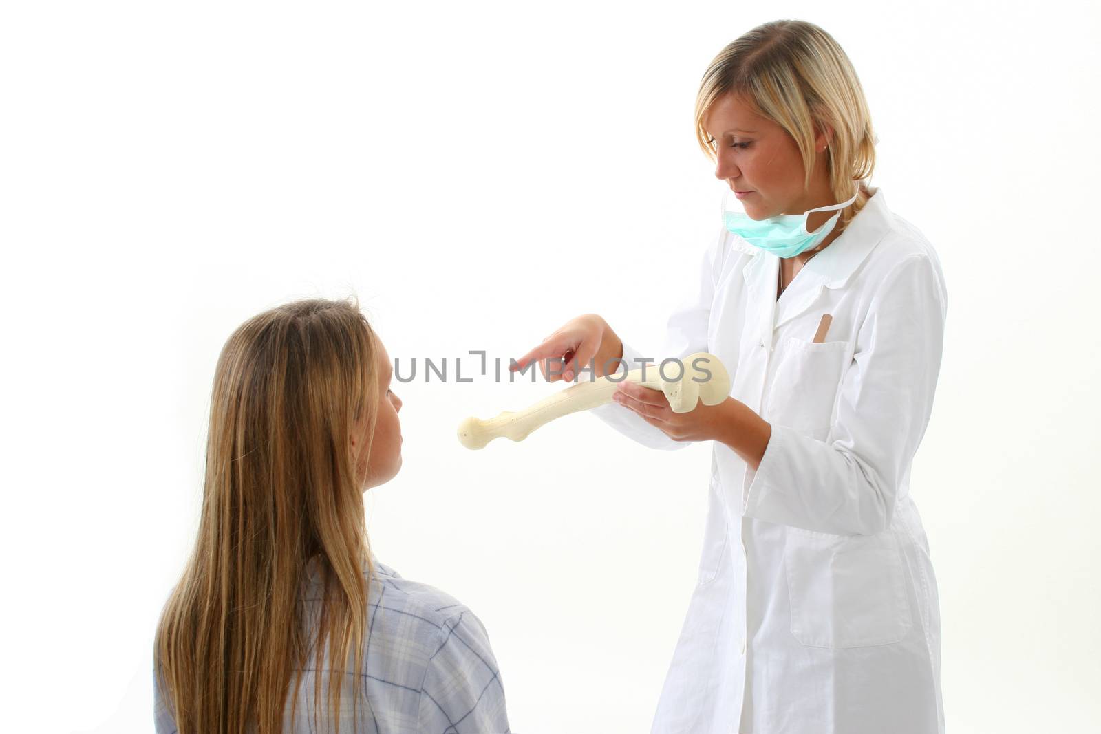 Doctor showing pacient how she has broken her bones