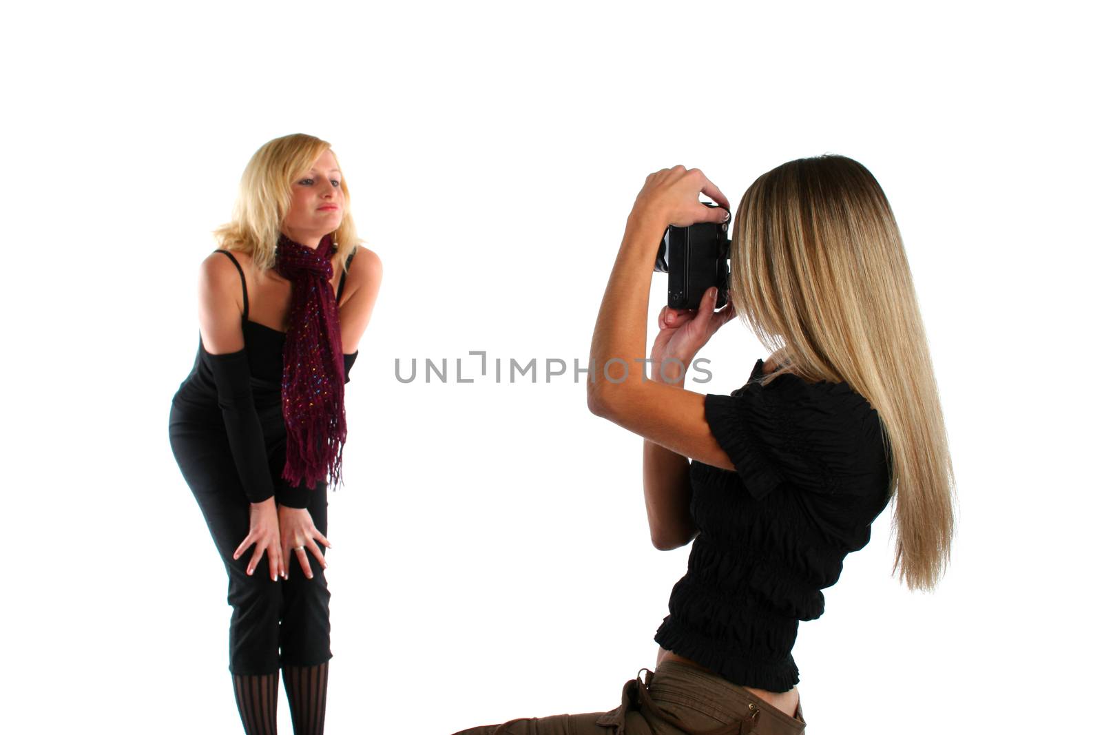 Beautiful felame photographer taking picture of a model