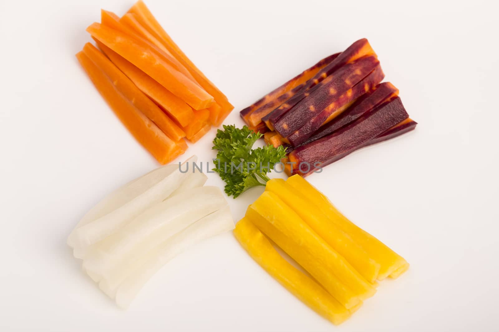 raw yellow, white, orange, red carrots by CatherineL-Prod