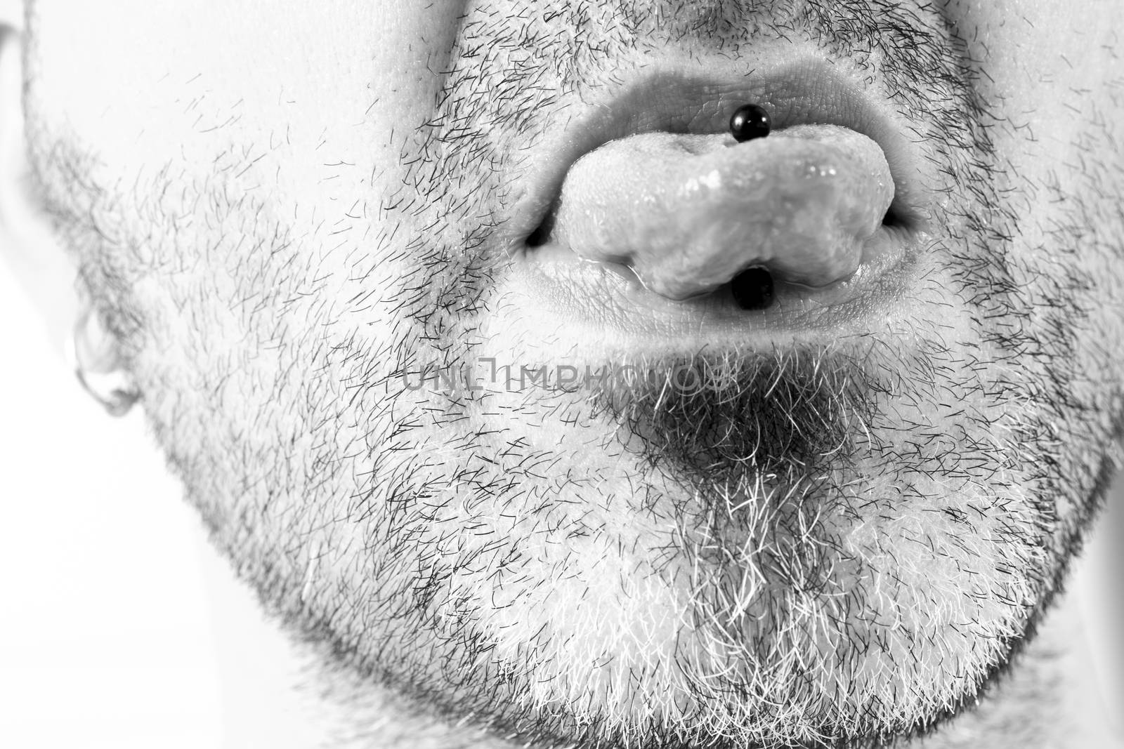 Man showing off his tongue ring by CatherineL-Prod