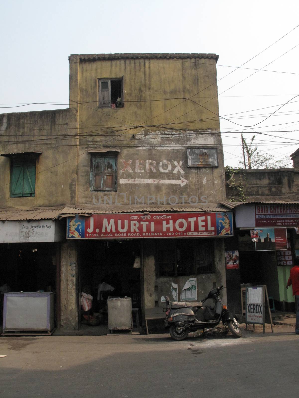 Streets of Kolkata. J. Murti Hotel by atlas