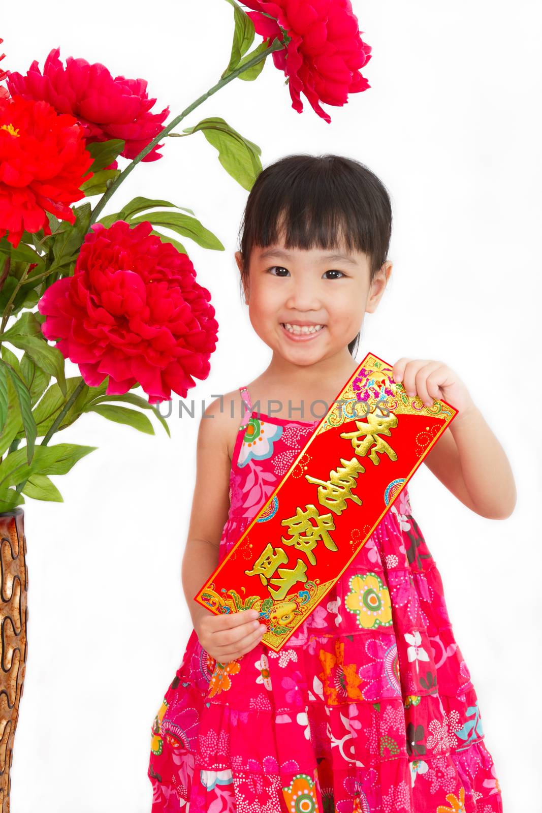 Chinese little girl pising holding  Spring festival couplets by kiankhoon