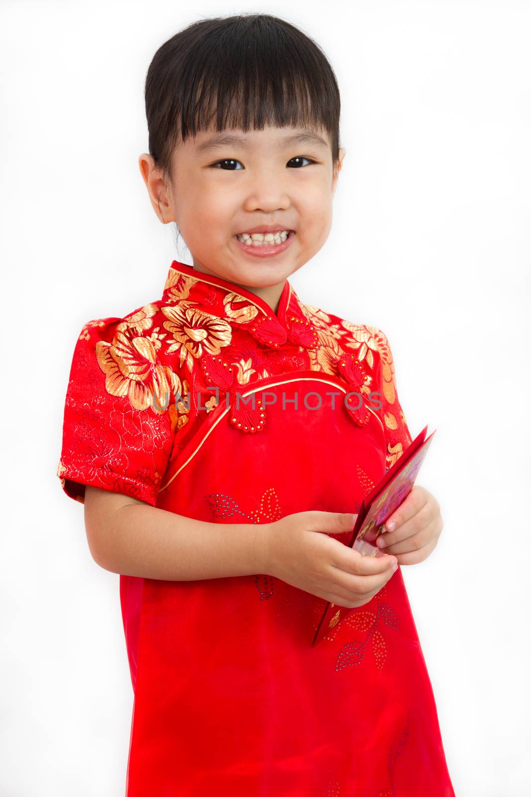 Chinese little girl holding red envelope greeting for Chinese New Year in plain white isolated background.