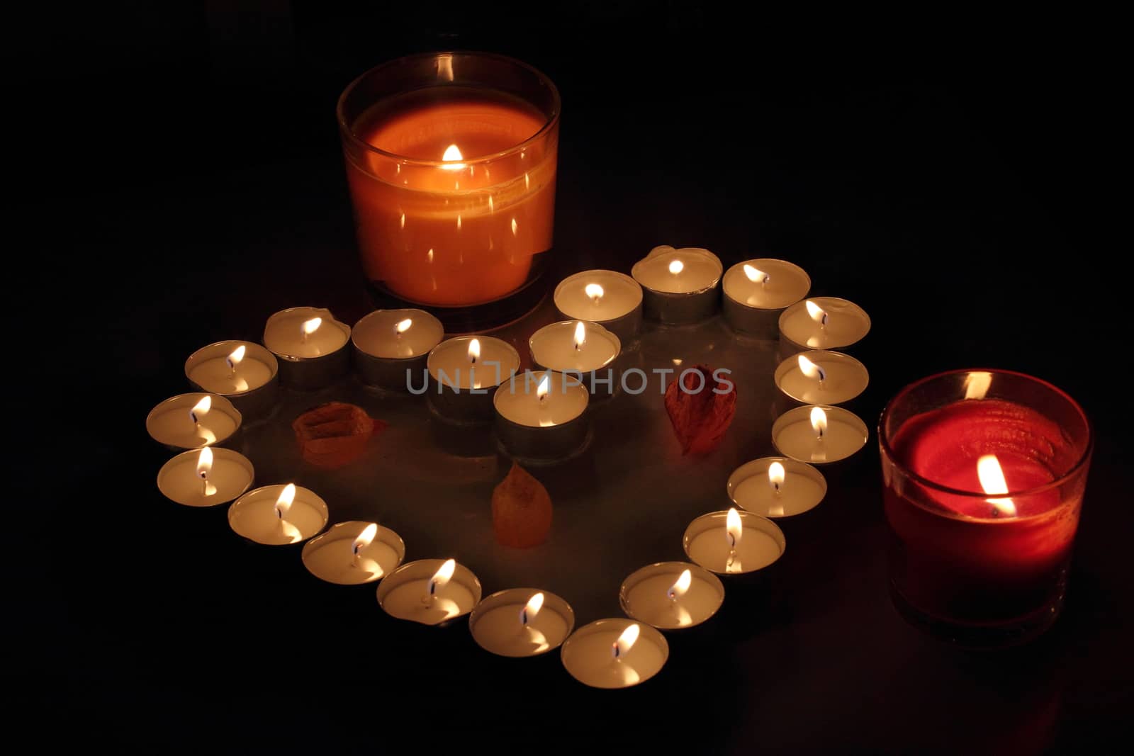 Heart of candles, a sign of love. romantic evening