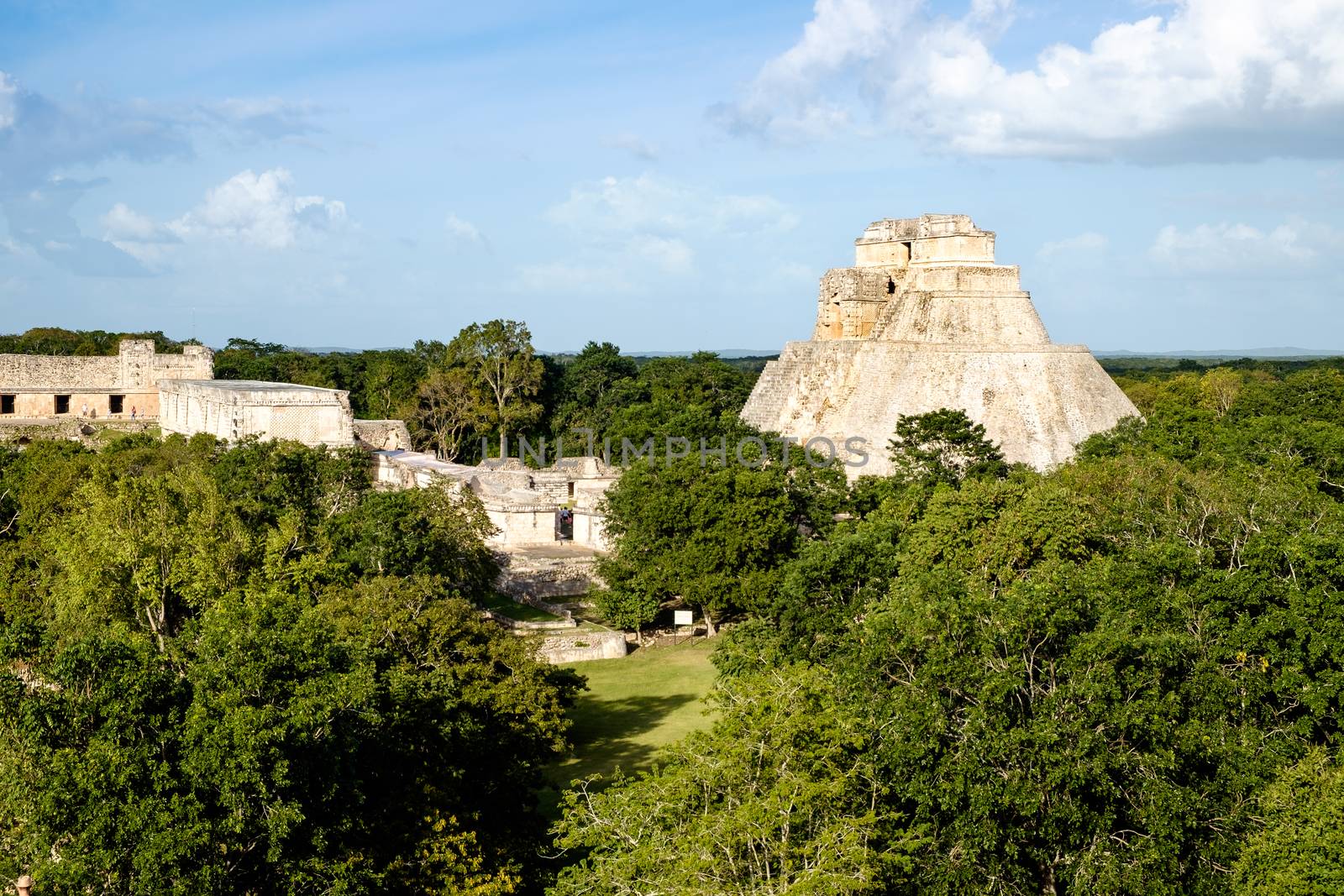 Landscape view of Uxmal archeological site with pyramids and ruins, Mexico