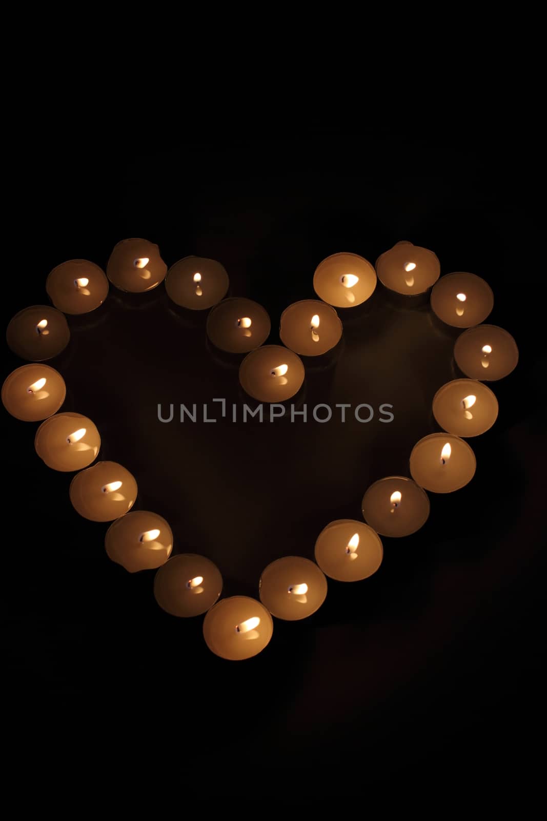 Heart of candles, a sign of love. romantic evening