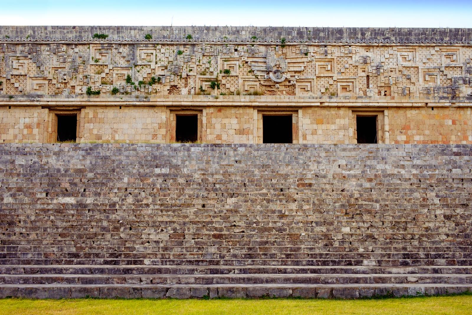 Detail view of ancient decorated wall and stairs in archeological site Uxmal, Mexico