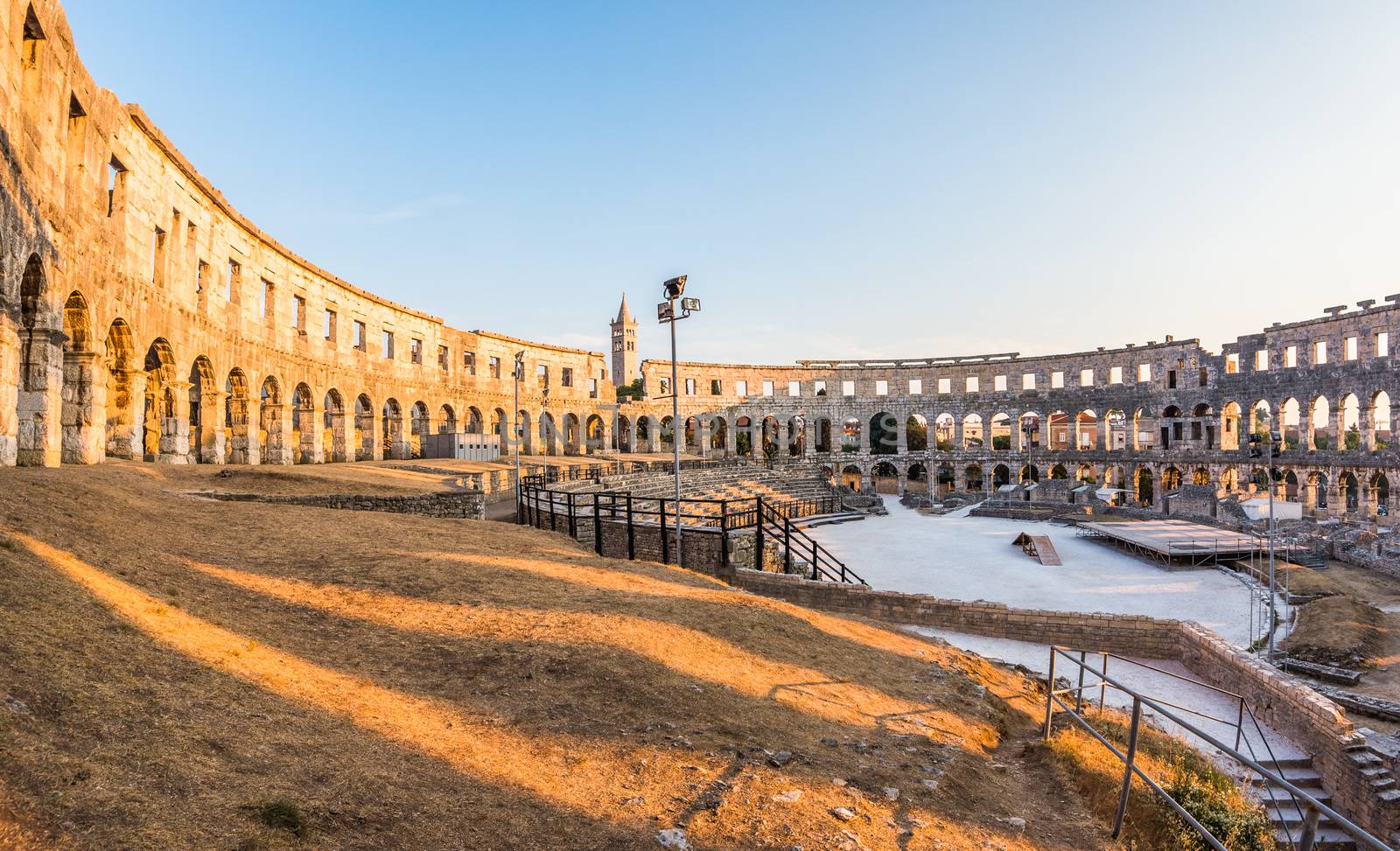 Inside of Ancient Roman Amphitheater in Pula, Croatia, Famous Travel Destination, in Sunny Summer Evening