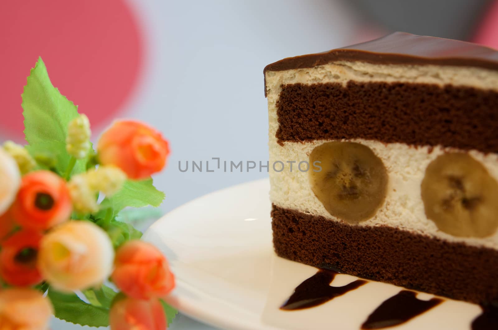 Piece of banana chocolate cake in restaurant by ninun