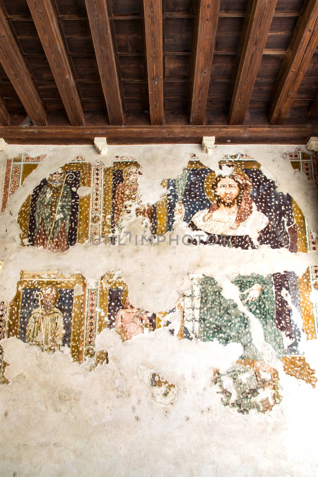 Fresco damaged to be restored in a cloister of a medieval church.