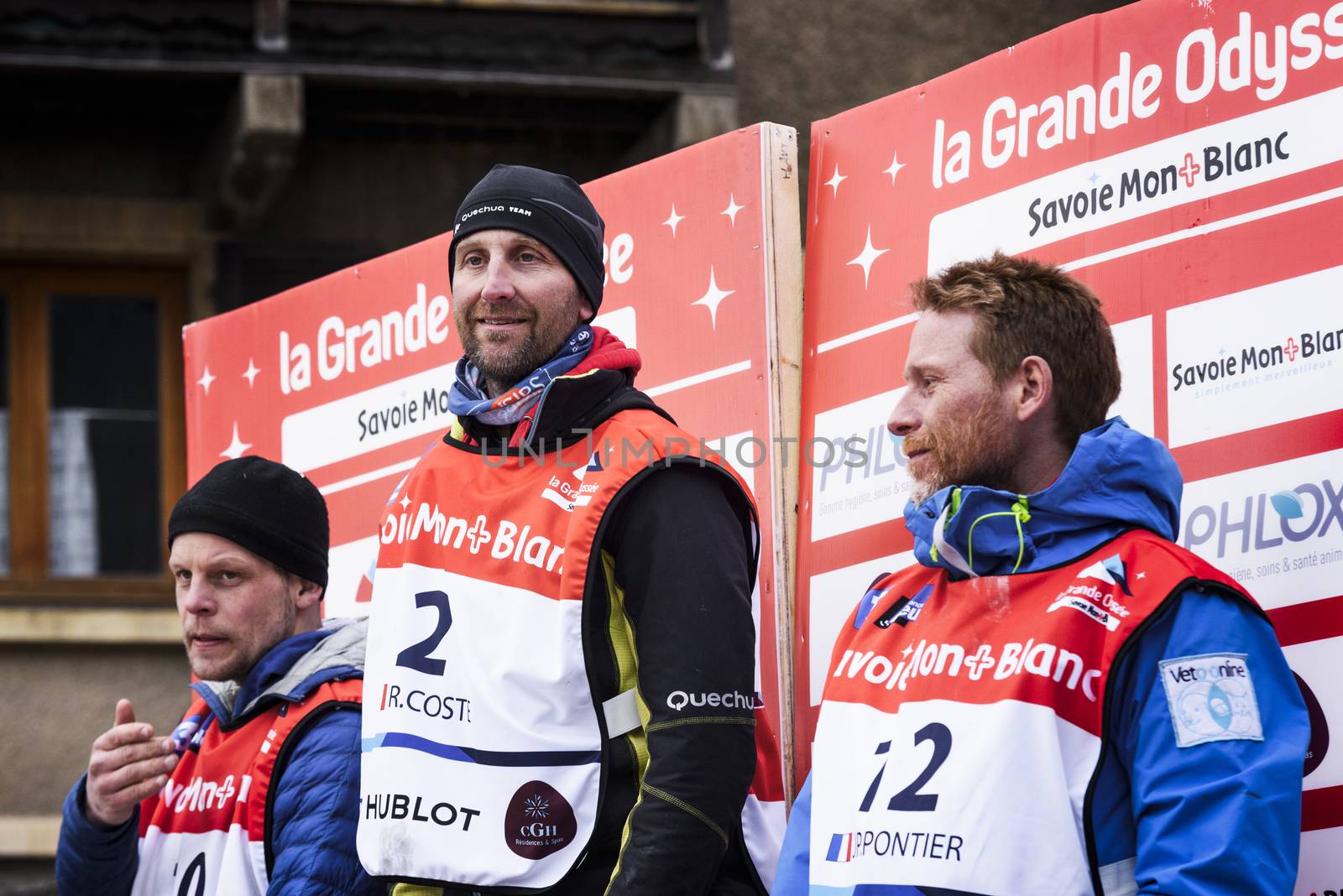 TERMIGNON, VANOISE, FRANCE - JANUARY 20 2016 - The podium Remy COSTE the winner of the GRANDE ODYSSEE the hardest mushers race, the 2nd Jimmy PETTERSSON and 3th named Jean-Philippe PONTHIER, Vanoise, Alps