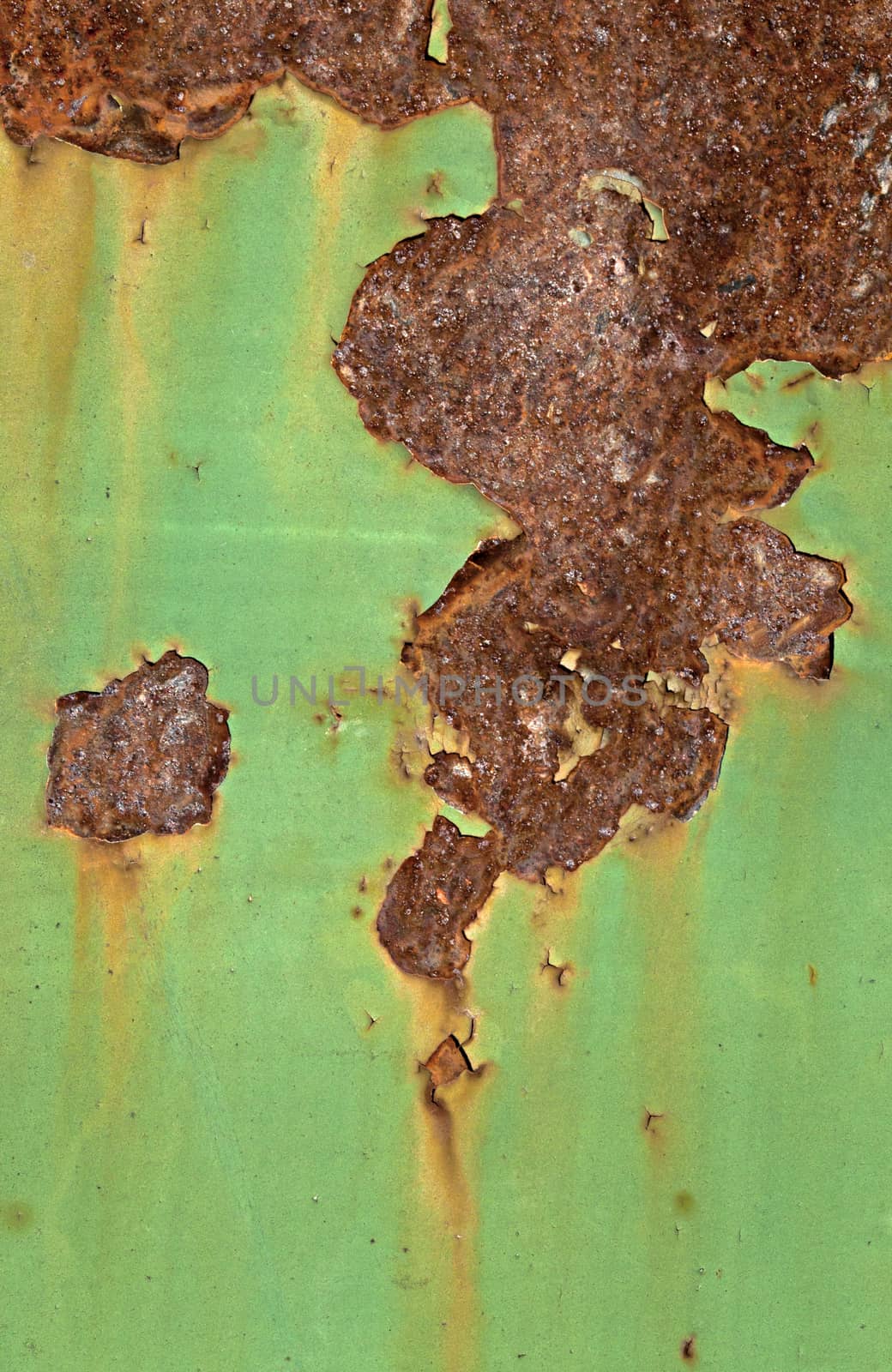 Close-up of peeling paint and rust on a wall