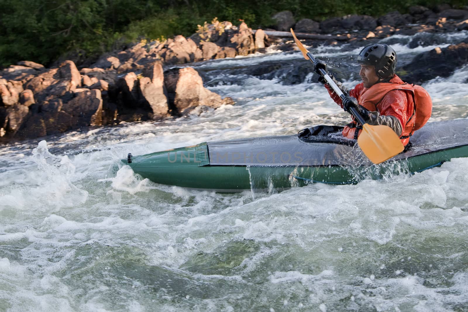 Kayaker in whitewater by Goodday