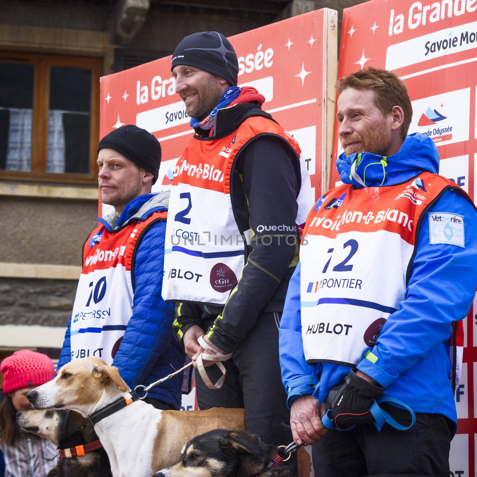 TERMIGNON, VANOISE, FRANCE - JANUARY 20 2016 - The podium Remy COSTE the winner of the GRANDE ODYSSEE the hardest mushers race, the 2nd Jimmy PETTERSSON and 3th named Jean-Philippe PONTHIER, Vanoise, Alps