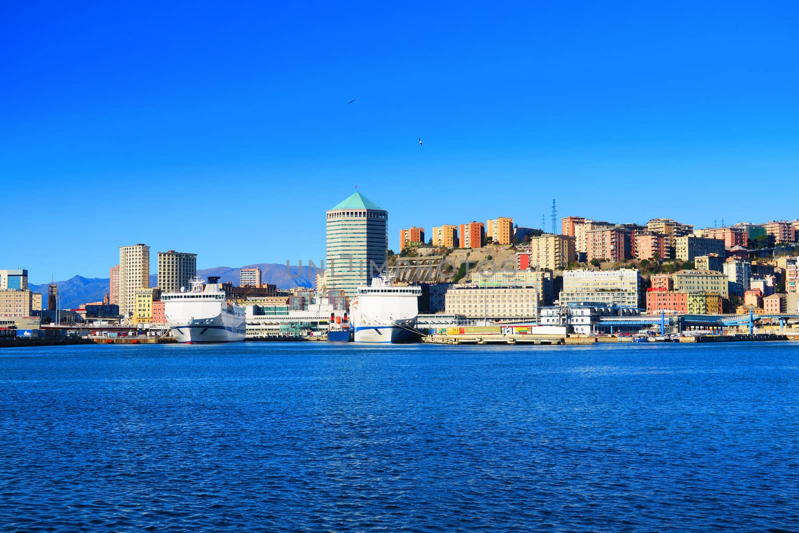 View of Genoa port. It is clearly visible the famous "Matitone", an octagonal skyscraper 109 meters high.