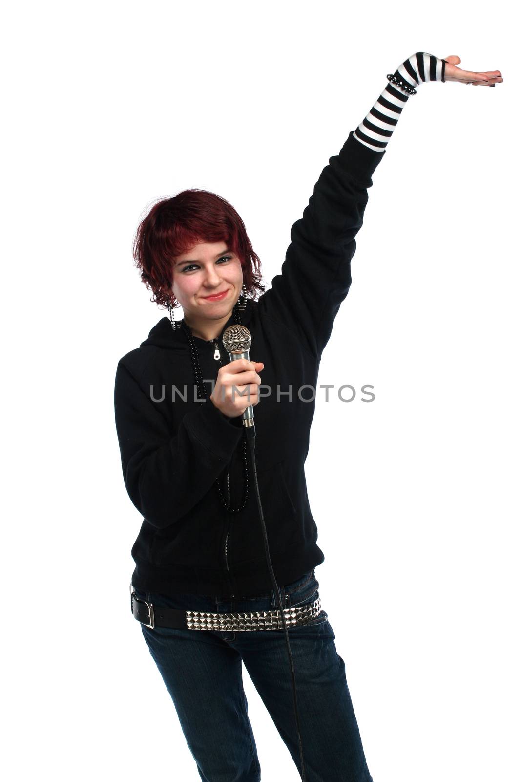 Teen girl singing with a microphone