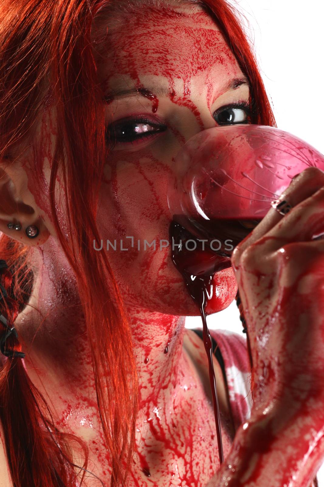 Beautiful red hair girl covered in blood