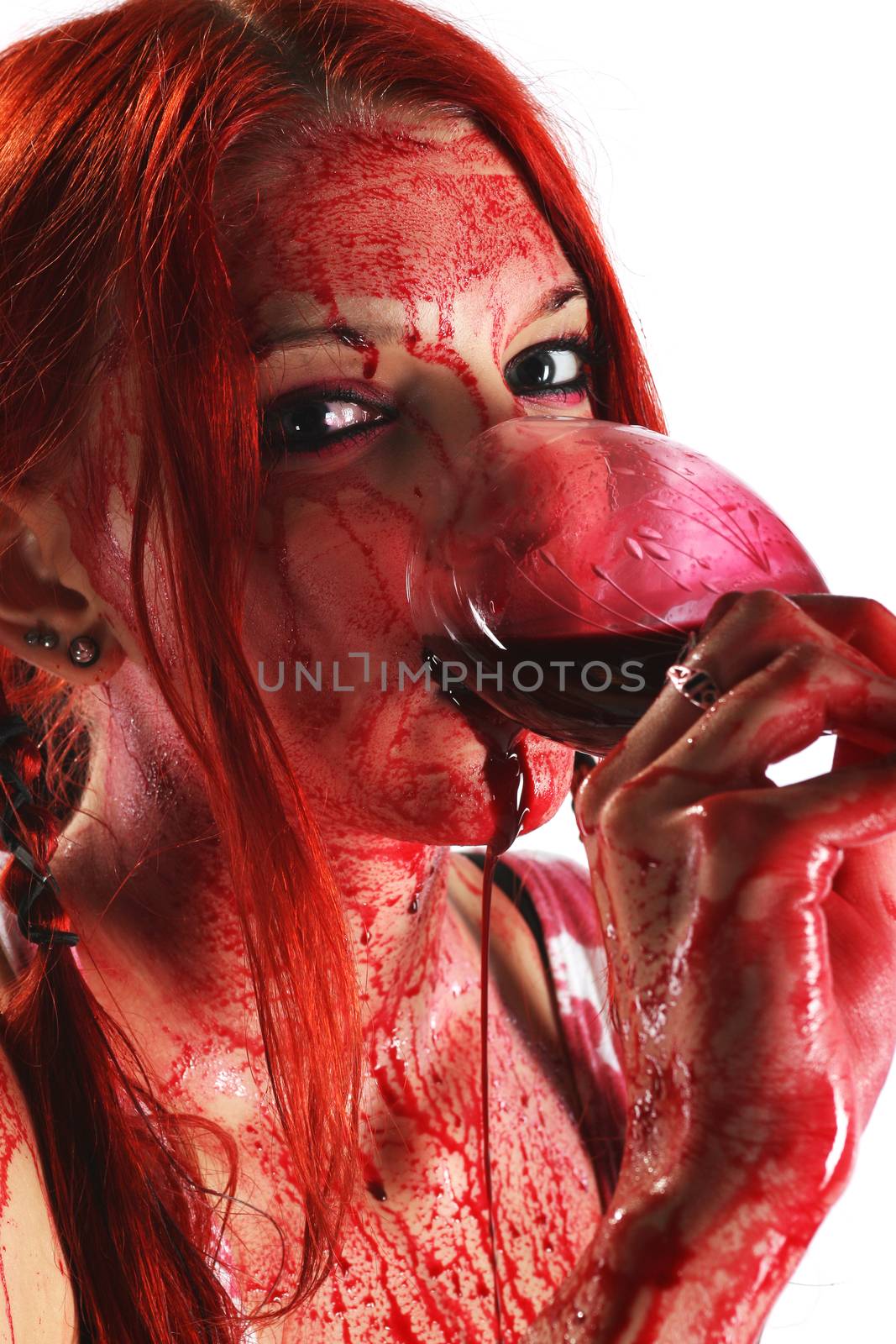 Beautiful red hair girl covered in blood