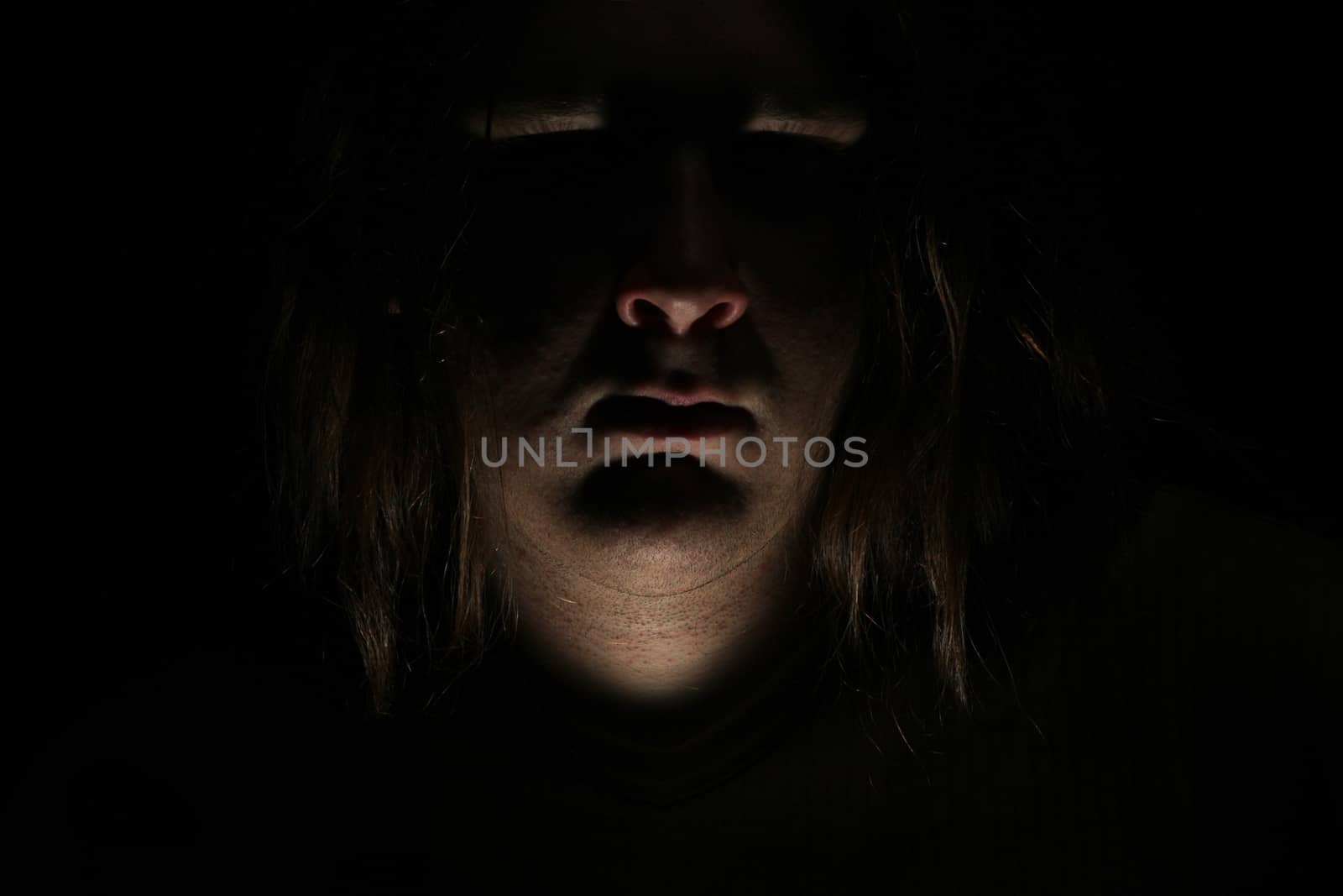 Dark evil face on black background