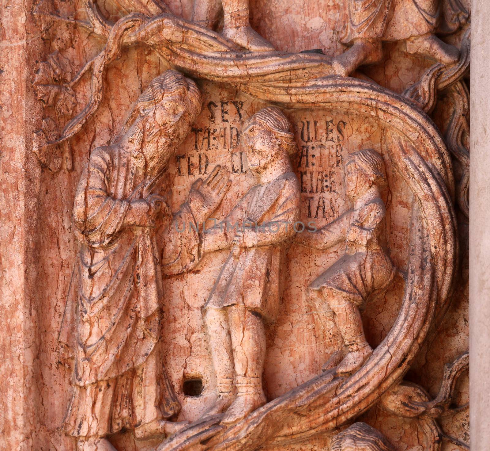 Christ Performing Works of Mercy relief at the baptistry from Benedetto Antelami, Parma, Emilia Romagna, Italy