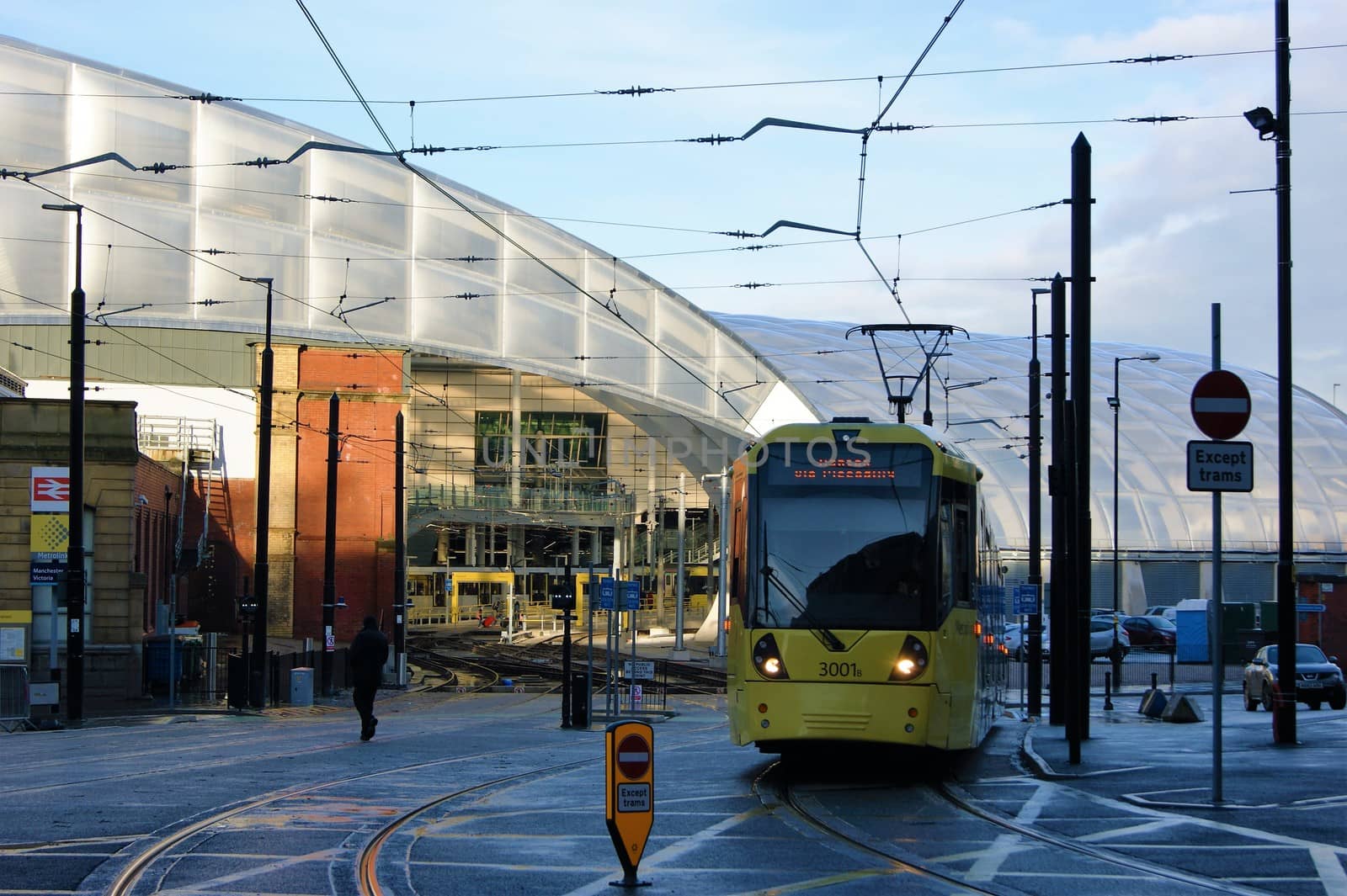 An image of an electric tram leaving Victoria station in Manchester, North West England,