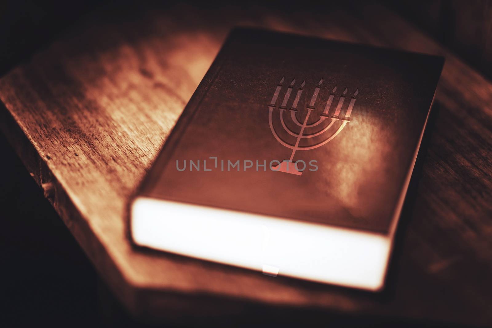 Holy Bible in Dark Browny Vintage Color Grading. Glowing Light Holy Bible