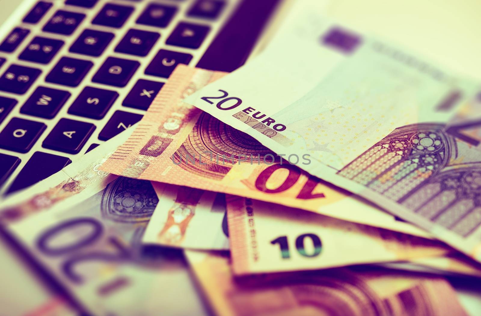 Successful Online Business Concept with Laptop Keyboard and Euro Bills. Making Money on the Internet Business Concept.