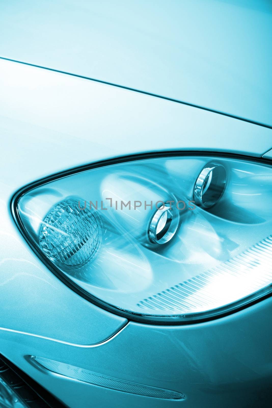 Car Design Concept. Modern Headlight Optics Closeup. Transportation Theme.