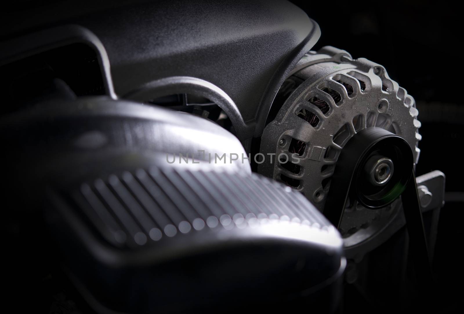 Car Alternator Closeup Photo. Modern Car Electric Generator Device.