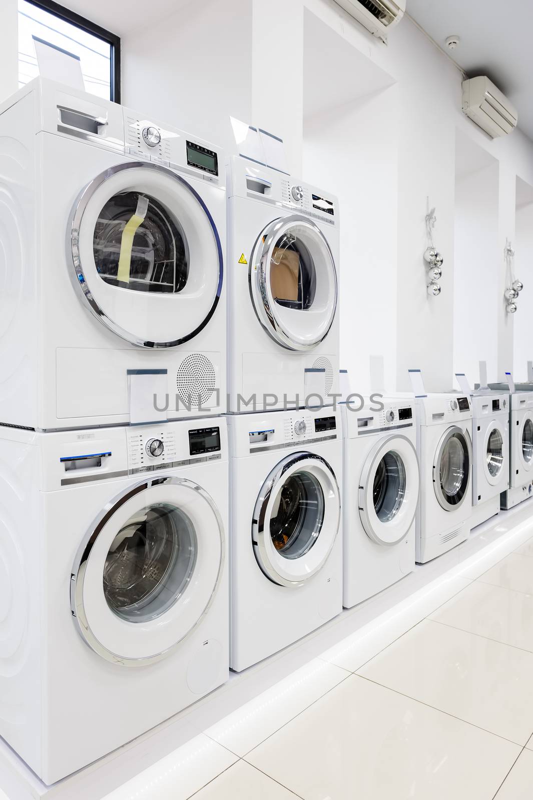 Row of washing mashines in appliance store