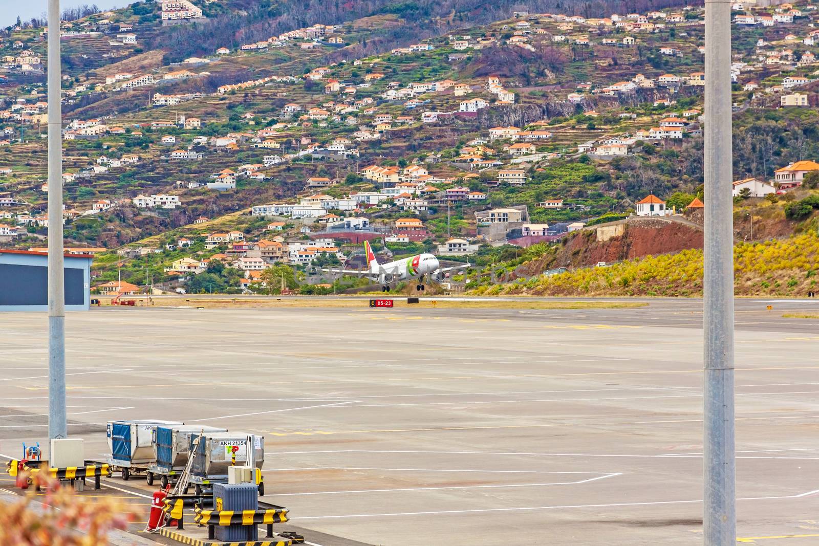 Funchal, Madeira, Portugal - May 30, 2013: At the airport of Madeira (Aeroporto Madeira) - an airplane Airbus A318 from TAP Portugal Airline on approach of landing.