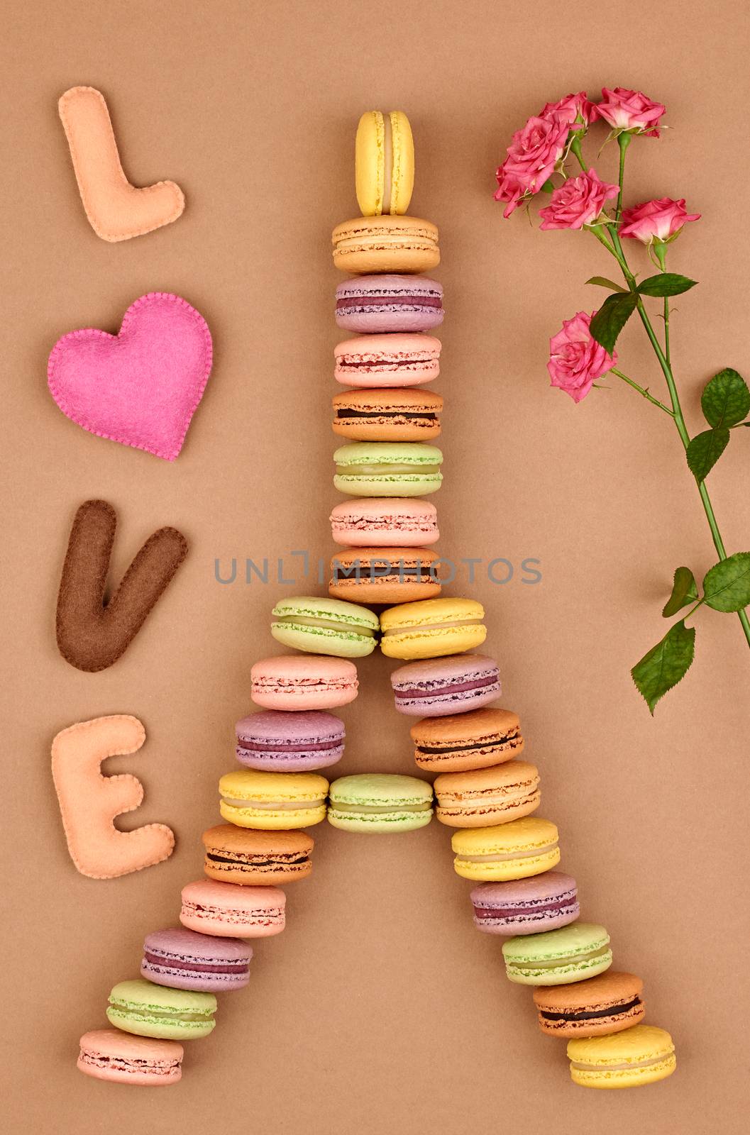 Macarons Eiffel Tower french sweet colorful, Word Love heart, roses. A lot of fresh  pastel delicious biscuit dessert on chocolate retro vintage background.                                           