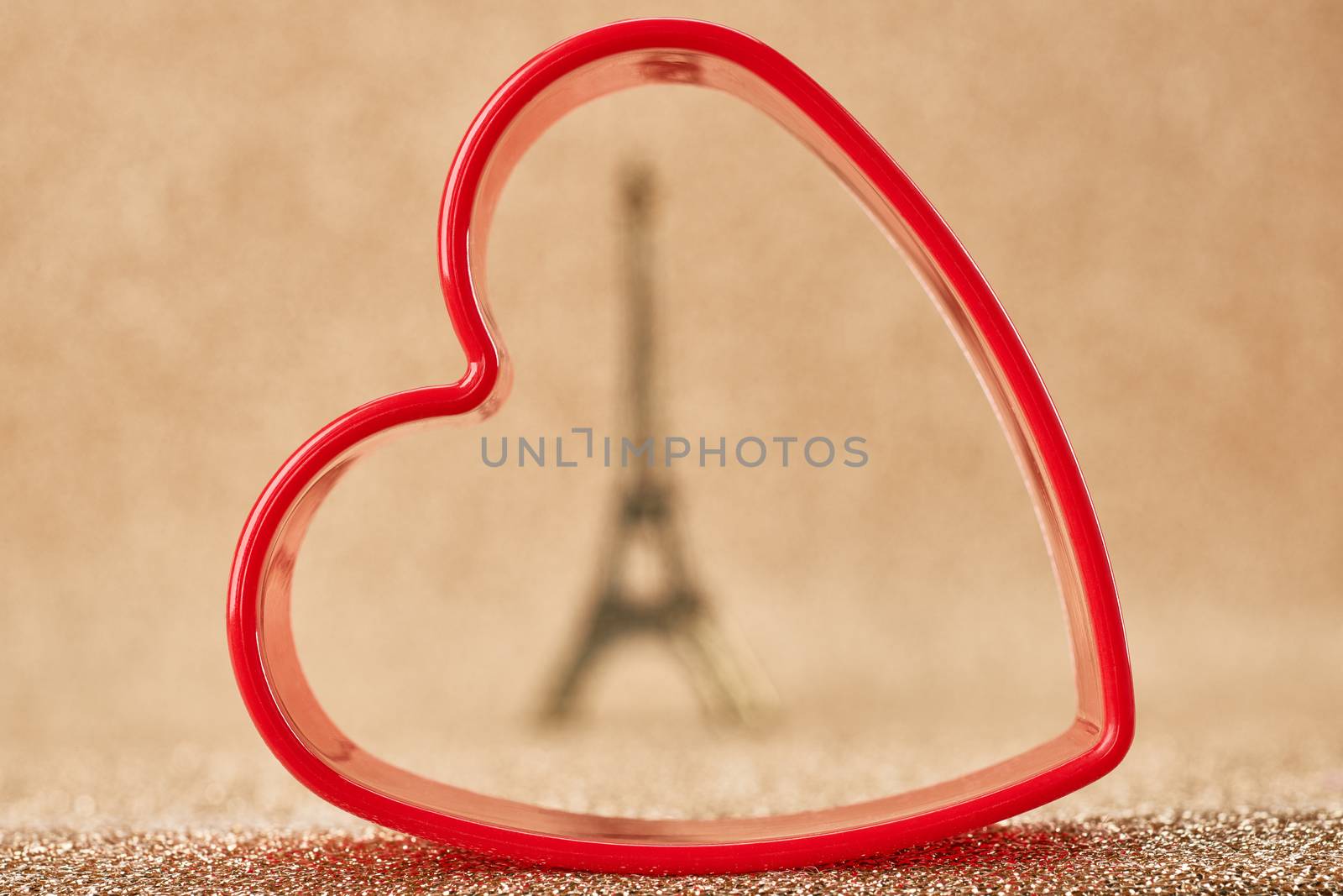 Valentines Day. Love. Red heart, Eiffel Tower, souvenir from Paris. Vintage retro  romantic style. Unusual creative art greeting card, gold background, copyspace