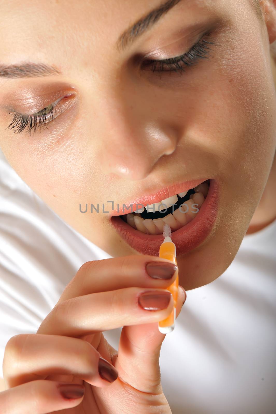 Female teeth with  interdental brush