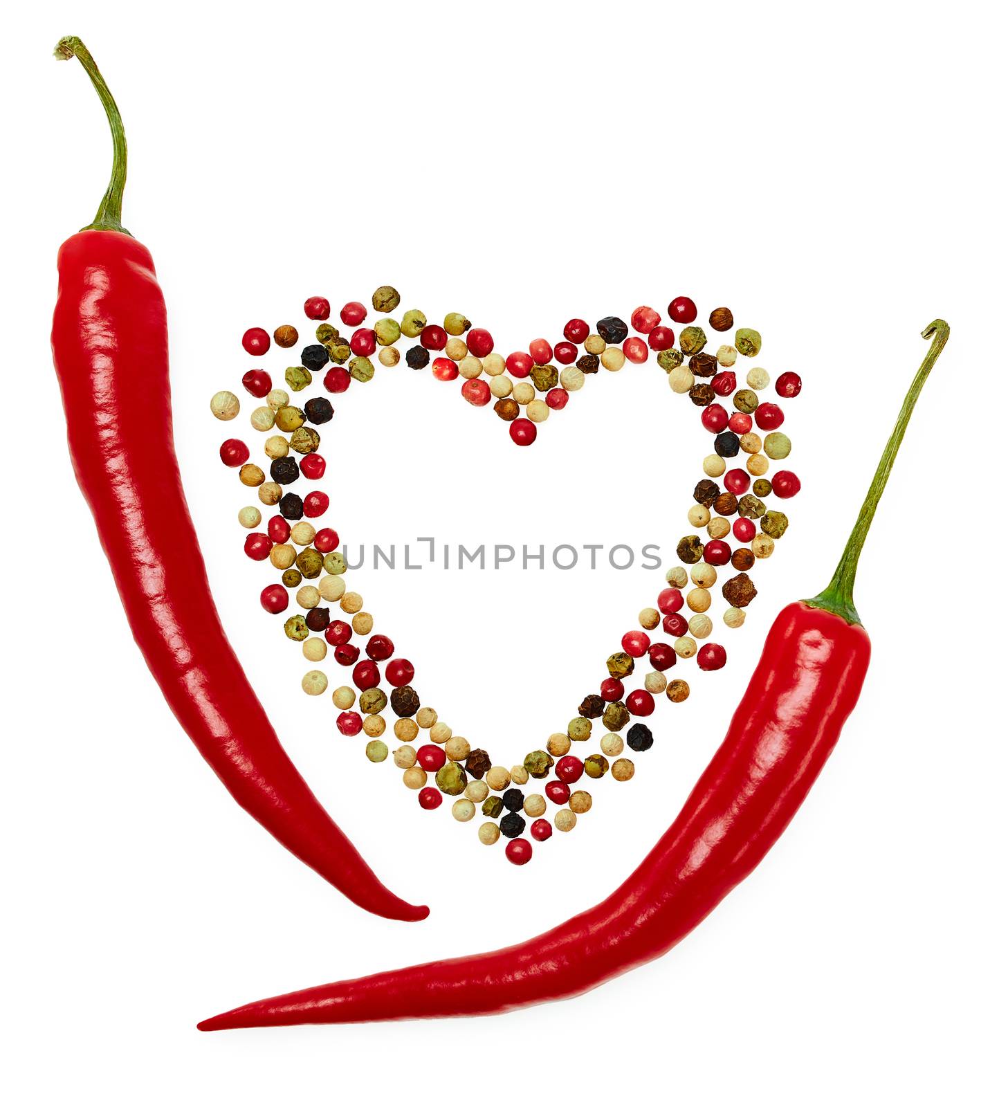 Peppers in pods, red hot and colorful mixture of peppercorns, concept of love. Multicolored peppers peas in heart shape, food closeup. Isolated on white background
