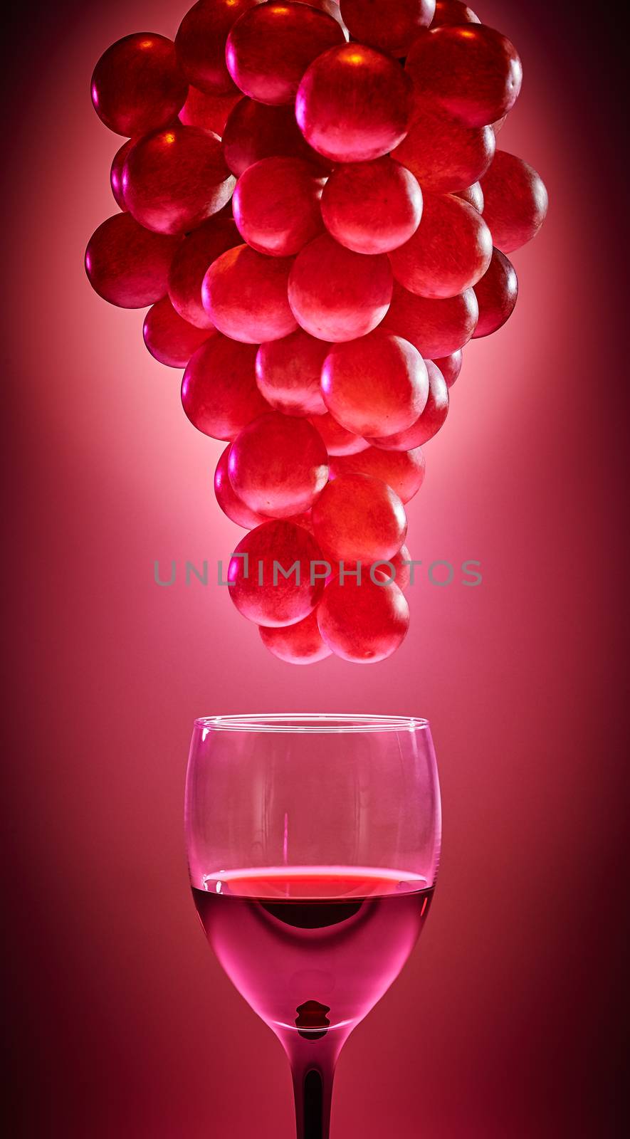 Ripe red grapes with glass of wine. Red background by 918