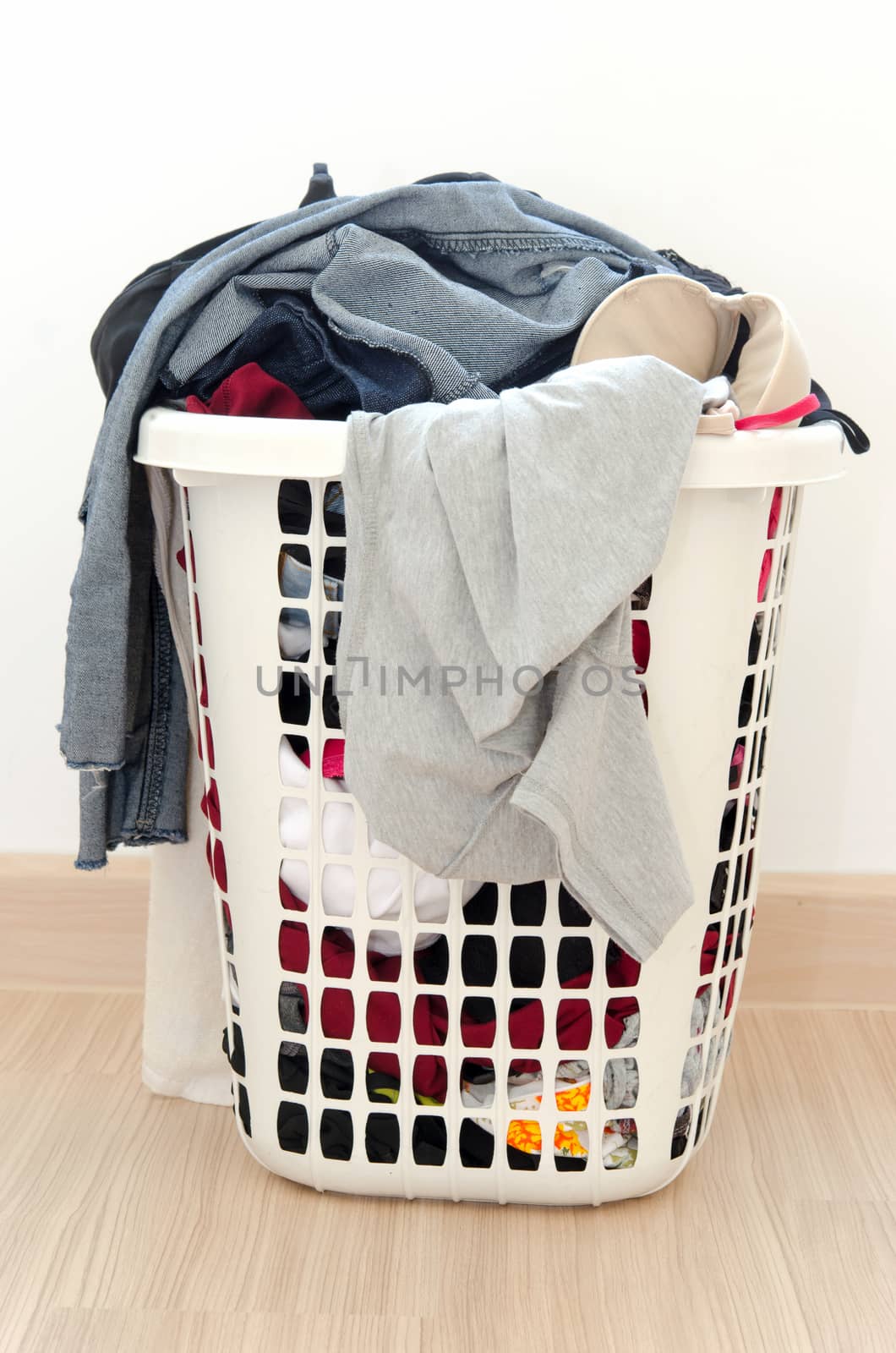 Clothes basket on floor in room.