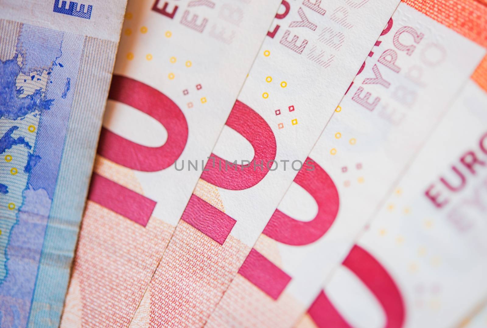 Pinky Ten Euro Bills. Euro Currency Closeup Photo.